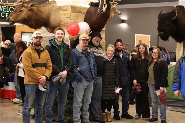 Banquet guests gather beneath wildlife displays